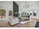 Cozy living room with fireplace, lots of natural light, and an inviting atmosphere at 1406 Pika Rd, Boulder, CO 80302