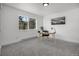 Cozy office space with a large window showcasing a beautiful forest view at 1406 Pika Rd, Boulder, CO 80302