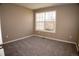 Bedroom with neutral carpet, a window providing natural light, and ample space at 19803 Victorian Way, Parker, CO 80138