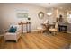 Comfortable open concept dining area with wood floors, flowing to the kitchen with bar stool seating at 19803 Victorian Way, Parker, CO 80138