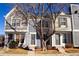 Charming townhouse with a well-maintained front yard and appealing architectural details, including varied siding at 19803 Victorian Way, Parker, CO 80138