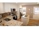 Bright, updated kitchen featuring granite counters, a center island, and stainless steel appliances at 19803 Victorian Way, Parker, CO 80138