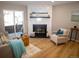 Inviting living room featuring a cozy fireplace and sliding glass doors for natural light at 19803 Victorian Way, Parker, CO 80138