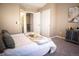 Bright main bedroom boasting an ensuite bathroom, closet, and serene atmosphere at 19803 Victorian Way, Parker, CO 80138