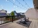 Relaxing deck area with outdoor seating and string lights at 5399 Valentia St, Denver, CO 80238