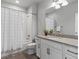 Bathroom vanity features granite counter tops, basin sink and decorative mirror at 5399 Valentia St, Denver, CO 80238