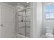 Bathroom with tile shower, and toilet at 5399 Valentia St, Denver, CO 80238