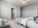 Bright bedroom with ensuite bathroom featuring an area for sitting and relaxing at 5399 Valentia St, Denver, CO 80238