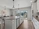 Bright kitchen with island, granite countertops, stainless appliances and a dining area, perfect for entertaining at 5399 Valentia St, Denver, CO 80238