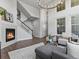 Cozy living room with staircase, fireplace, and comfortable seating arrangement at 5399 Valentia St, Denver, CO 80238