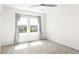Bright bedroom with a ceiling fan and a bright window with gray curtains at 23293 E Jamison Dr, Aurora, CO 80016