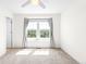 Bright bedroom with a ceiling fan and a bright window providing a neighborhood view at 23293 E Jamison Dr, Aurora, CO 80016