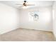 Spacious bedroom with a ceiling fan and a bright window providing natural light at 23293 E Jamison Dr, Aurora, CO 80016