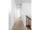 Bright hallway with neutral carpet and white walls leads to other rooms in the house at 23293 E Jamison Dr, Aurora, CO 80016