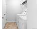 Functional laundry room with tile flooring and washer and dryer hookups at 23293 E Jamison Dr, Aurora, CO 80016