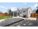 The home's exterior shows a sunroom, grill, a fenced yard, and concrete patio at 1757 S Elm St, Denver, CO 80222