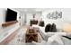 Modern living room with a white sectional sofa, wooden accents, and stylish decor at 1757 S Elm St, Denver, CO 80222