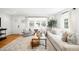 Bright living room with hardwood floors, large windows, comfortable seating, and stylish decor at 1757 S Elm St, Denver, CO 80222
