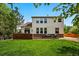 Well-maintained backyard with lush green lawn, brick patio, and cozy outdoor seating area at 4915 Sage Brush Dr, Broomfield, CO 80023