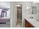 Well-lit bathroom featuring a walk-in shower and vanity with modern fixtures at 4915 Sage Brush Dr, Broomfield, CO 80023