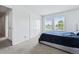 Bedroom featuring dual windows, and a dark blue bed at 4915 Sage Brush Dr, Broomfield, CO 80023