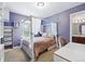 Stylish bedroom featuring a four poster bed and attached bathroom at 4915 Sage Brush Dr, Broomfield, CO 80023