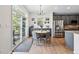 Breakfast nook with access to backyard. Stainless steel appliances and grey cabinets are showcased at 4915 Sage Brush Dr, Broomfield, CO 80023