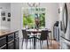 Breakfast nook with view of the backyard. Grey cabinets and stainless steel appliances at 4915 Sage Brush Dr, Broomfield, CO 80023