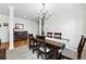 Dining room featuring a wooden table set with a chandelier above at 4915 Sage Brush Dr, Broomfield, CO 80023