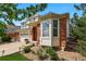 Brick and siding exterior view of a two story home, landscaping, three car garage, blue sky at 4915 Sage Brush Dr, Broomfield, CO 80023