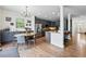Modern kitchen with stainless steel appliances, grey cabinets, granite counters, eat-in table, and island at 4915 Sage Brush Dr, Broomfield, CO 80023