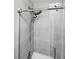 Modern shower with grey tile and dual showerheads at 4915 Sage Brush Dr, Broomfield, CO 80023