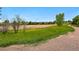 Community with beautiful walking path and lush greenery creates a serene and inviting atmosphere at 4915 Sage Brush Dr, Broomfield, CO 80023