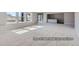 Finished basement with neutral carpet, large windows, and bar area at 9752 Canyon Wind Pt, Parker, CO 80138
