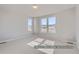 Well-lit bedroom with plush carpeting and bright, sunny windows at 9752 Canyon Wind Pt, Parker, CO 80138