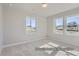 Bedroom featuring ample natural light and neutral carpeting at 9752 Canyon Wind Pt, Parker, CO 80138