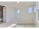 The spacious bedroom offers carpet, lots of windows and neutral paint at 9752 Canyon Wind Pt, Parker, CO 80138