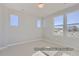 This bedroom offers great natural light from the large windows and neutral walls at 9752 Canyon Wind Pt, Parker, CO 80138