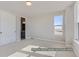 Bright bedroom with a closet and a window providing ample natural light at 9752 Canyon Wind Pt, Parker, CO 80138