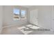 Bright bedroom with natural light, carpet, and a closet with sliding doors at 9752 Canyon Wind Pt, Parker, CO 80138