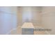 Walk in closet includes shelving and a center island for organization at 9752 Canyon Wind Pt, Parker, CO 80138