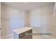 Walk in closet includes shelving and a center island for organization at 9752 Canyon Wind Pt, Parker, CO 80138