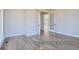 Spacious living room with hardwood floors and elegant French doors at 9752 Canyon Wind Pt, Parker, CO 80138