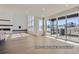 Bright living room featuring a fireplace, large windows, and sliding doors to the outside at 9752 Canyon Wind Pt, Parker, CO 80138