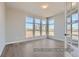 Bright living room with hardwood floors and large windows offering views at 9752 Canyon Wind Pt, Parker, CO 80138