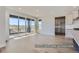 Open concept living room with sliding glass doors opening to a balcony with expansive views at 9752 Canyon Wind Pt, Parker, CO 80138