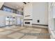 Open concept living room with fireplace, high ceilings, balcony, and large sliding glass doors at 9752 Canyon Wind Pt, Parker, CO 80138