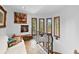 Bright hallway with spiral staircase, white walls, and charming window views at 10231 Democrat Rd, Parker, CO 80134