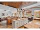 Gourmet kitchen with granite countertops, brick ceiling, and an open layout connecting to the living spaces at 10231 Democrat Rd, Parker, CO 80134