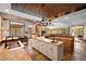 Large open kitchen featuring granite countertops and breakfast area, seamlessly flowing into the living room at 10231 Democrat Rd, Parker, CO 80134